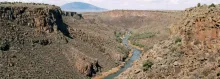 The Rio Grande winding through the deep basalt gorge at the Wild Rivers Recreation Area near Questa, New Mexico.
